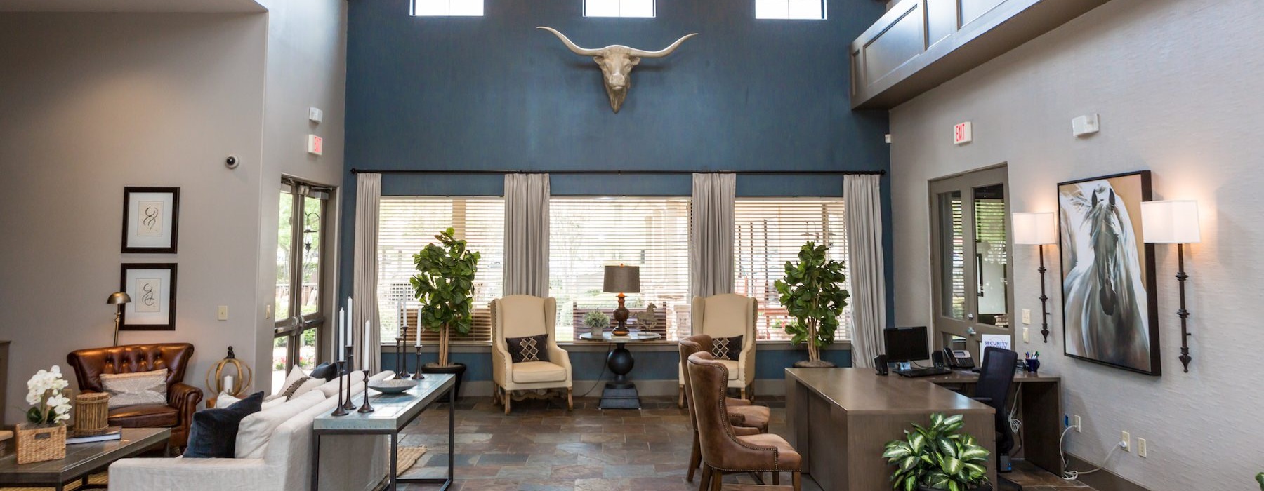 a clubroom with tables and chairs