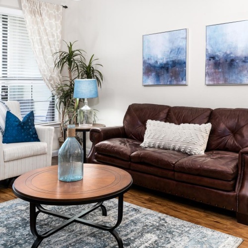 a living room with a couch and coffee table